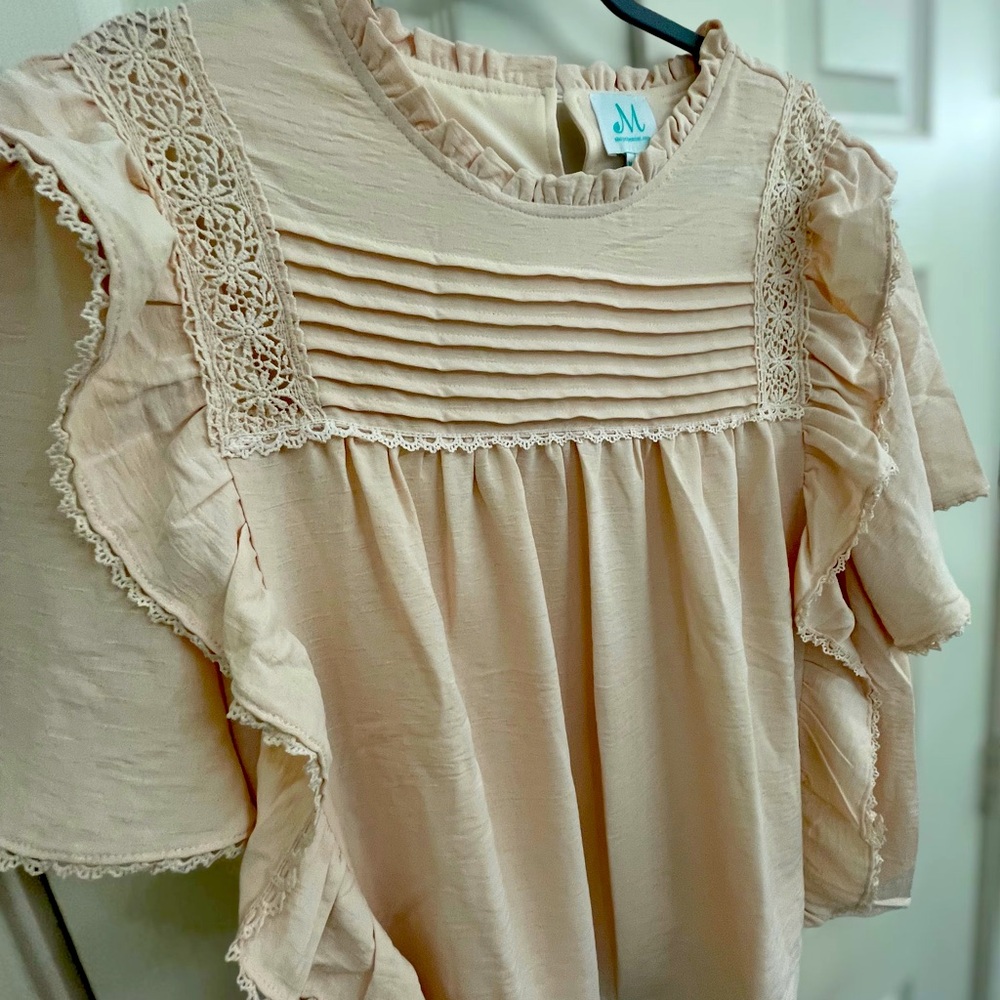 The Mint Julep Boutique Babydoll Blouse
NEW without tags